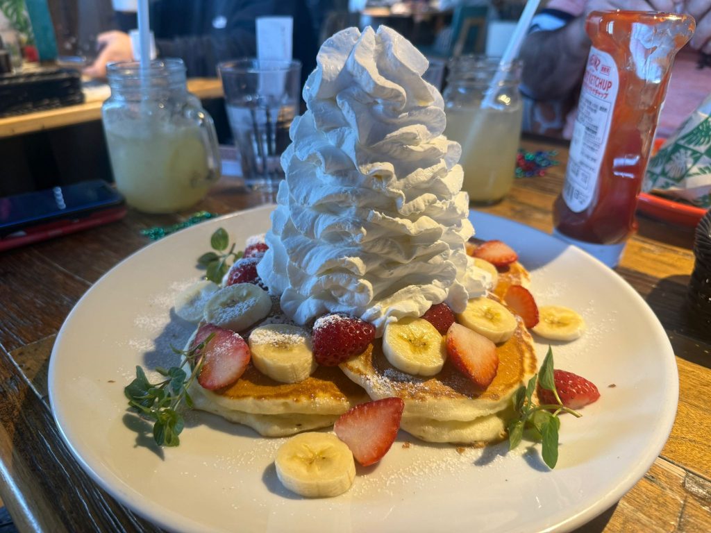 pancakes with cream, banana, strawberries
